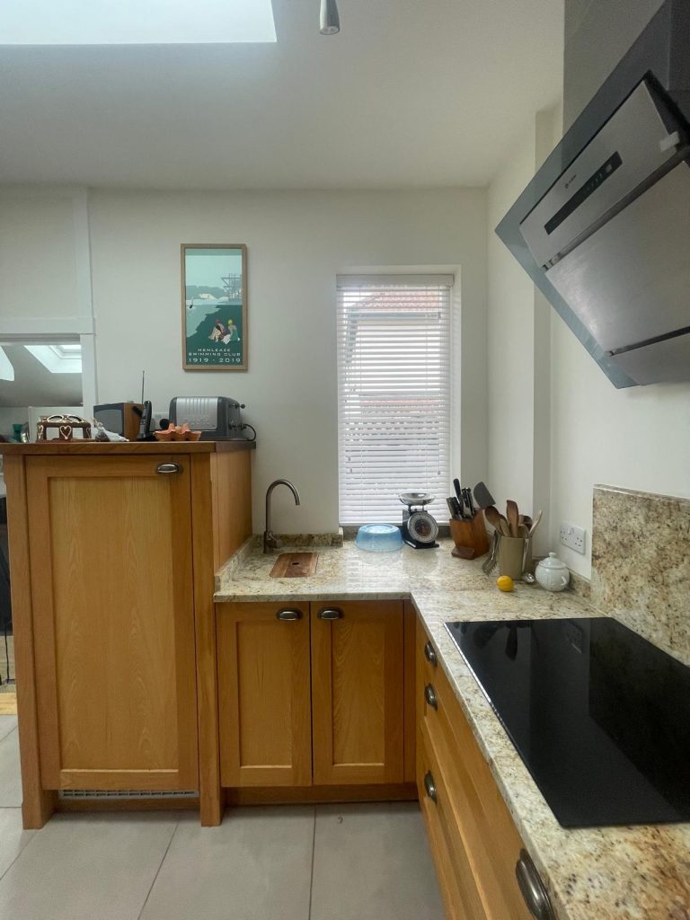 Kitchen wall painting project in BS6 Bristol with neat finish around windows and units