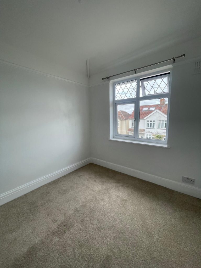 Completed bedroom decorating project in Southmead Bristol with clean white finish